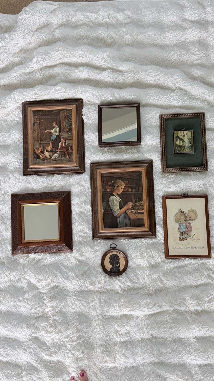 Dark wood frames gallery wall with mirrors